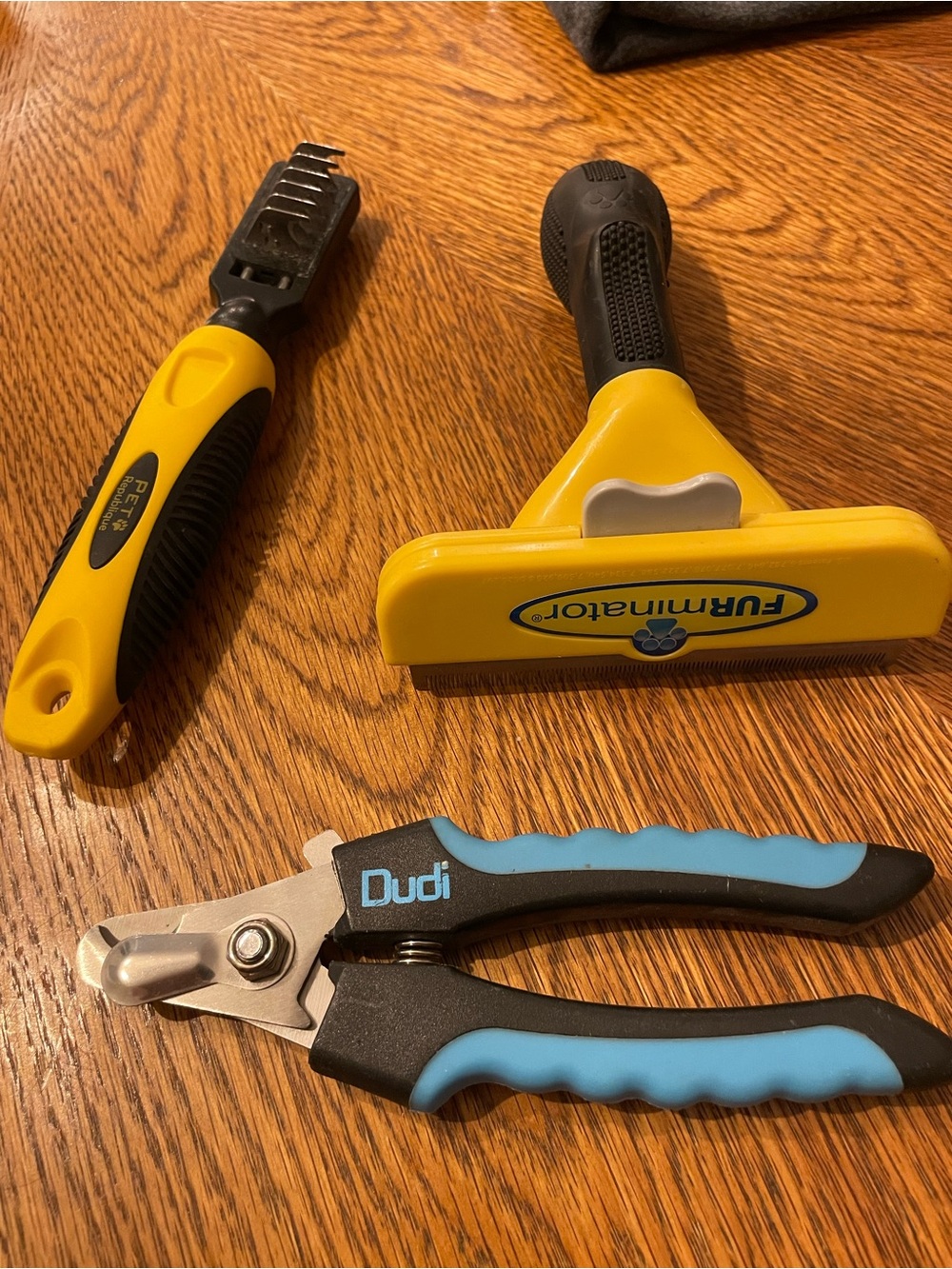 FURminator Yellow and Black Deshedding Tool with Blue-Accented Nail Clippers